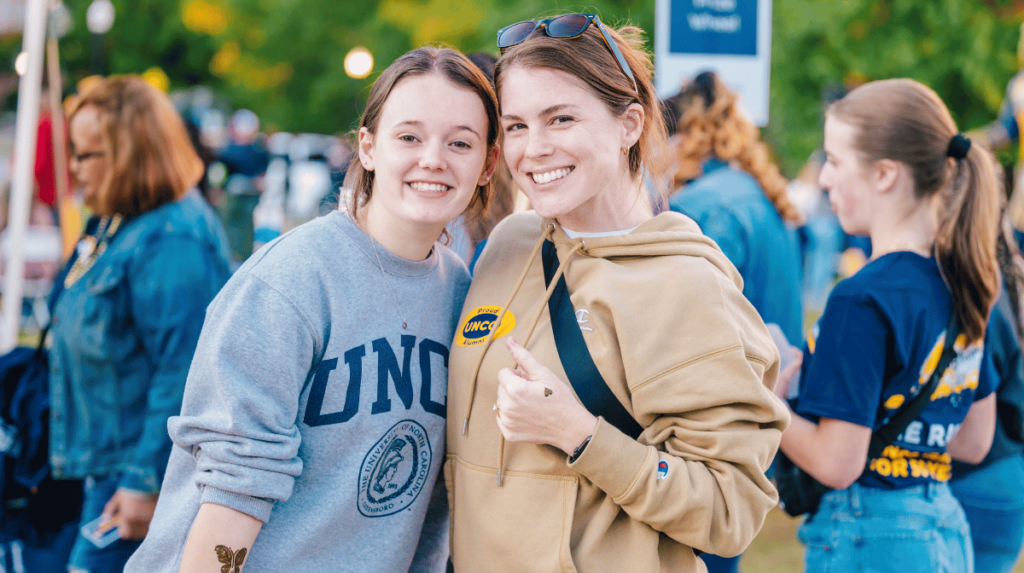 One student and one alumna at Homecoming